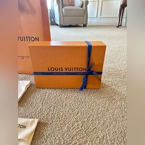 Authentic Louis Vuitton box, bag, ribbon, and duster bags. Fits Bumbag!